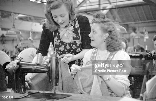 Year old Audrey Martin and 18 year old Audrey Richards work on an assembly line in a clothing factory in Leicester. Both have been selected by...