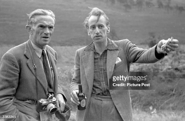 Picture Post writer Lionel Birch with photographer Kurt Hutton photographing Londoners on a weekend horse riding break near Ashdown Forest, Sussex....