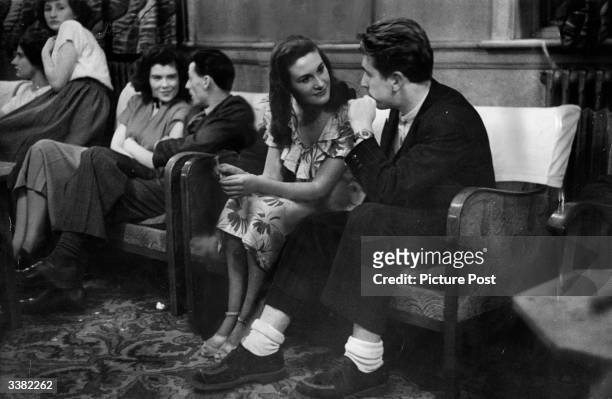Young couples sitting out a dance at the Bell Hotel in Leicester. Original Publication: Picture Post - 4670 - Is It True What They Say About...