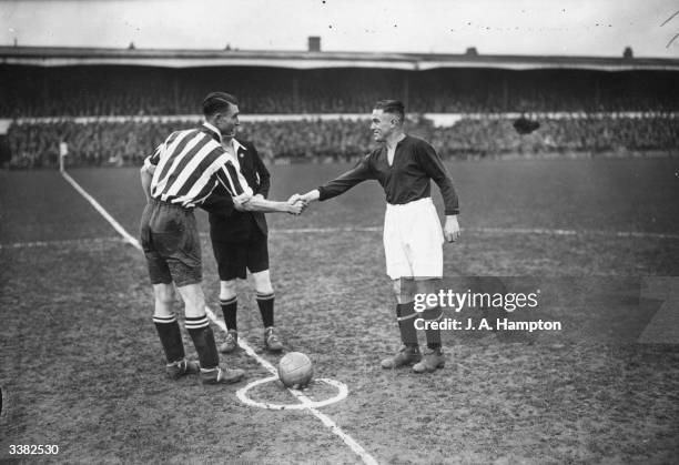Southampton captain, Bradford, shakes hands with Northampton captain, Crilly, before the kick off of an FA Cup tie replay between Northampton Town...
