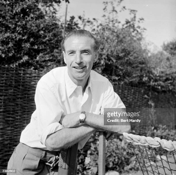 Stanley Matthews, 38-year-old Blackpool Football Club player and household name, relaxes at the lawn tennis court in the garden of his Blackpool...