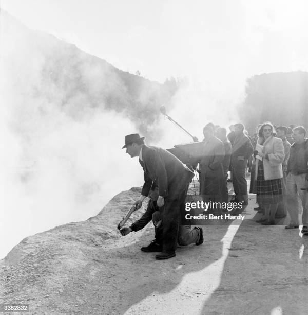 Italian film director Roberto Rossellini directing the film crew of 'Visit To Italy', on location in Naples. Original Publication: Picture Post -...