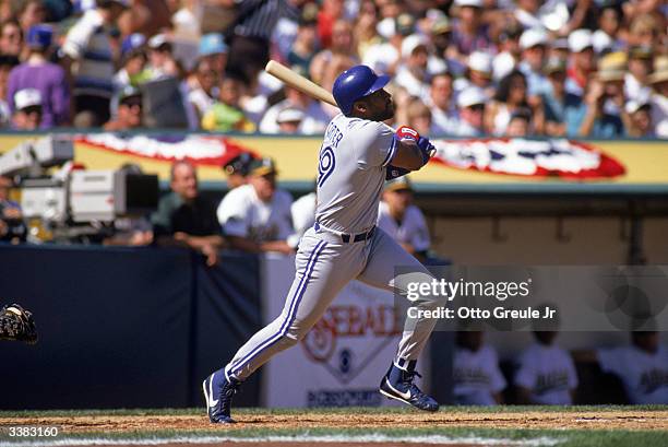 Outfielder Joe Carter of the Toronto Blue Jays swings during game 3 of the American League Championship Series against the Oakland A's on October 10,...