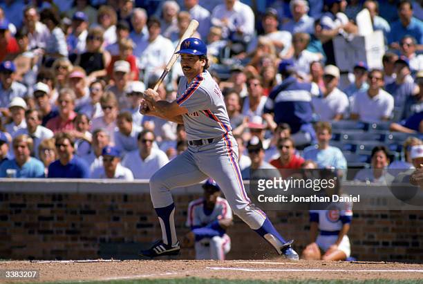First baseman Keith Hernandez of the New York Mets swings during a 1988 game against the Chicago Cubs at Wrigley Field in Chicago, Illinois.