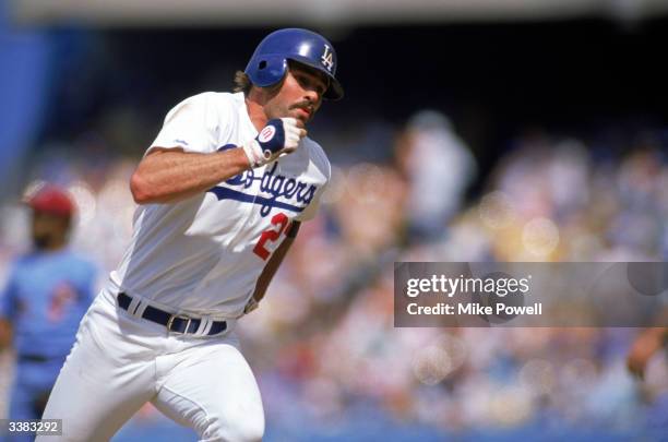 Outfielder Kirk Gibson of the Los Angeles Dodgers rounds the bases during a 1988 season game against the Philadelphia Phillies at Dodger Stadium in...