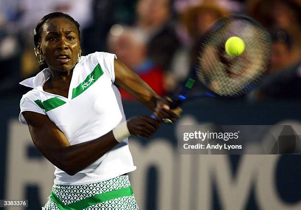 Venus Williams hits a return during her match against Marie-Gayanay Mikaelian of Switzerland during the Family Circle Cup on April 15, 2004 at the...