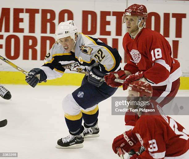 Kirk Maltby of the Detroit Red Wings defends Greg Johnson of the Nashville Predators during the third period of game five of the first round of the...