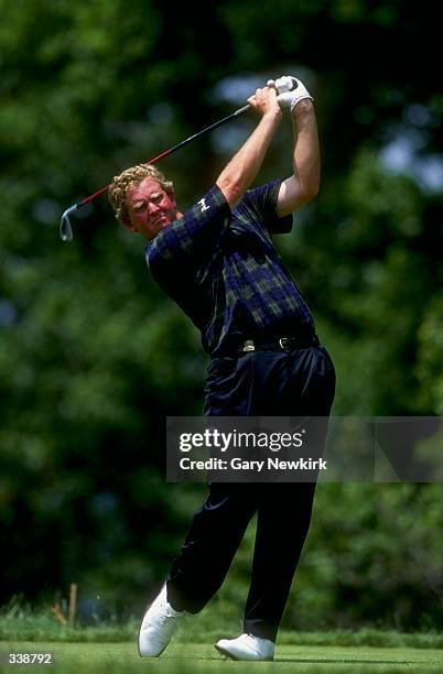 Colin Montgomerie watches the ball after his swing during the U.S Open at Oakmont Golf Course in Oakmont, Pennsylvania. Mandatory Credit: Gary...