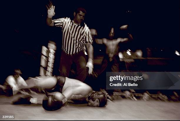 General view as the referee counts out a competitor during the Toughman Contest in Kalamazoo, Michigan. Mandatory Credit: Al Bello /Allsport