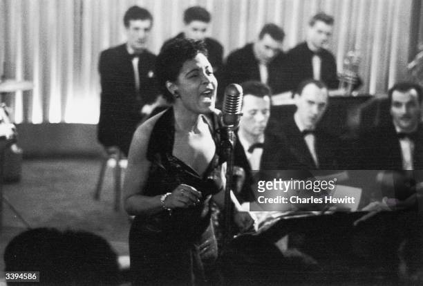 American jazz singer Billie Holiday , also known as 'Lady Day', during a performance, 1954. Picture Post - 7380 - Billie Holiday - unpub.