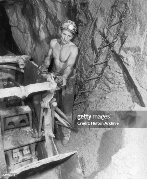 Polish miner Walter Misciewios at work underground at South Croft in Cornwall's largest tin mine, 8th August 1970. He is using a new air-driven...
