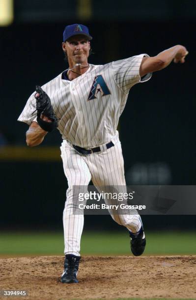 Pitcher Randy Johnson of the Arizona Diamondbacks delivers during the Opening Day game, which happened to be against the Colorado Rockies, at Bank...