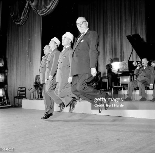 Comic musicians Alan Breeze, Alfie Reece, Frank Wilson and Billy Cotton performing as Billy Cotton's Wakey Wakey Band at the Coventry Hippodrome....