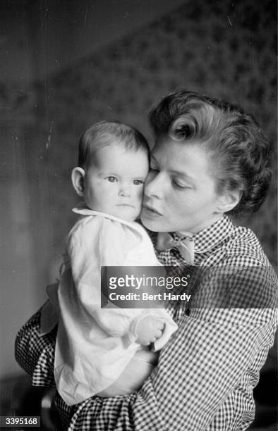 Swedish actress Ingrid Bergman with her eleven-month-old daughter Isabella Rossellini. Original Publication: Picture Post - 6514 - Ingrid Bergman's...