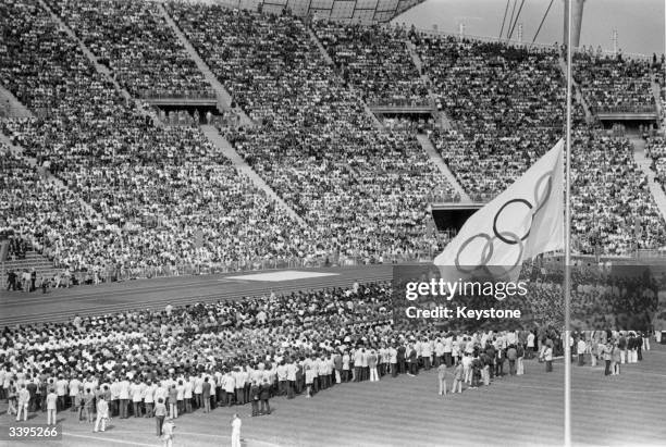 The Olympic flag flying at half-mast in the Olympic Stadium in Munich during the memorial service for the Israeli athletes who were killed by Arab...