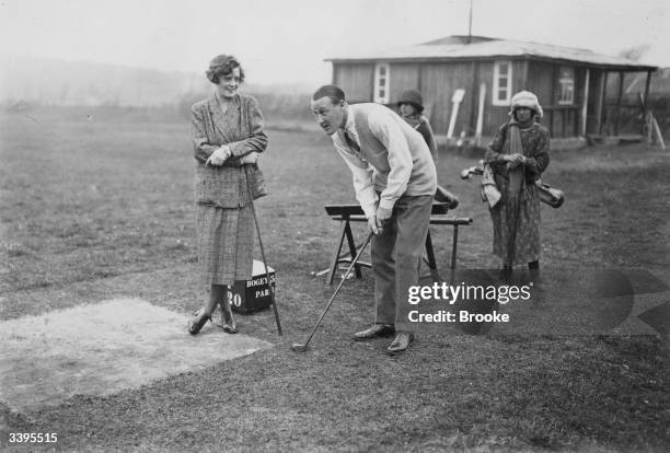 Mr and Mrs R H Tattershall play golf at the fashionable French resort of Le Touquet.