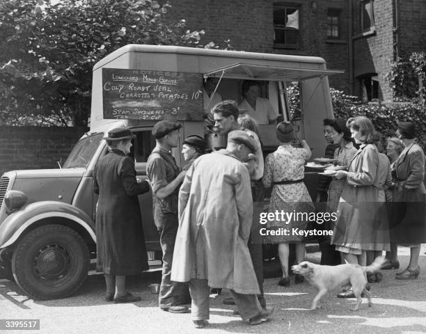 Mobile canteen stopping in a London street to offer people hot meals.