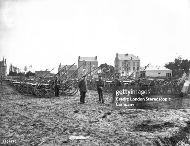 Prussian Army Soldiers guarding captured French artillery surrended to them at Sedan during the Franco-Prussian War.