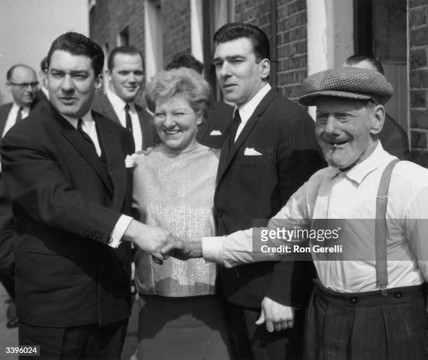 Infamous London gangsters Ronnie and Reggie Kray with their mother Violet and grandfather Jimmy Lee.