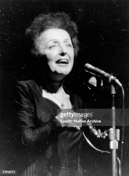 Parisian popular singer Edith Piaf , performing at the Olympia, Paris.