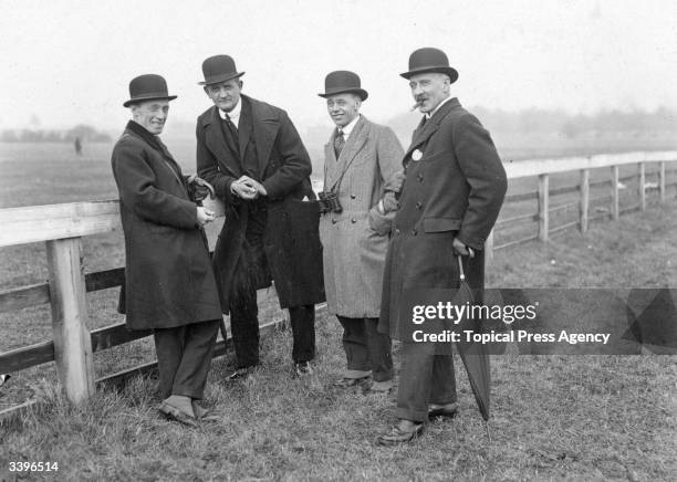 Spectators at the Cheltenham Steeplechases, left to right Major Doyle, Mr Geo De Vine, Mr A B Doyale and Col Turner.