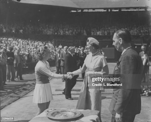 The Duchess of Kent congratulates American tennis player Maureen Connolly on winning the women's singles title at the Wimbledon Lawn Tennis...