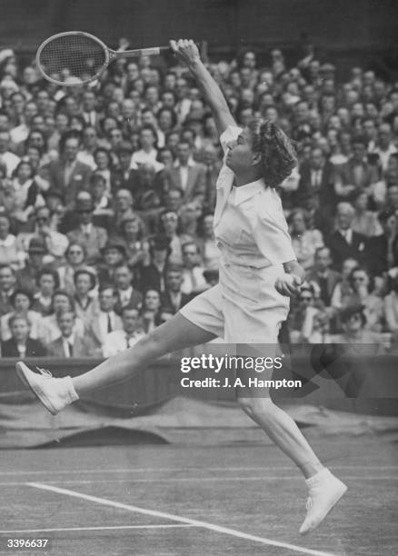 Louise Brough of the USA in action against fellow American Pauline Betz during the women's singles final at the Wimbledon Lawn Tennis Championships,...