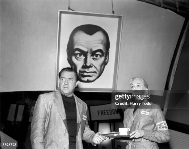 Edmond O'Brien , as Winston Smith and Jan Sterling as Julia, during the filming of an adaptation of George Orwell's novel, '1984'. The film was...