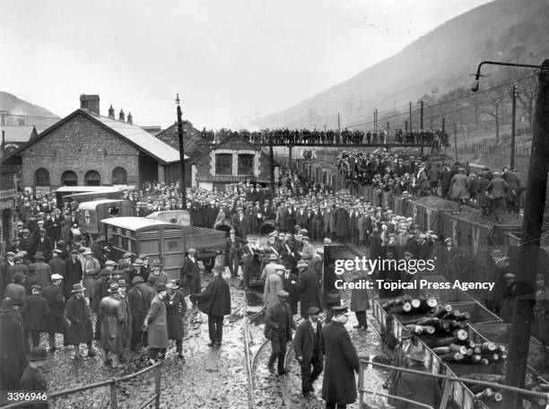 Large crowd waits at the pithead at Cwm near Ebbw Vale, Monmouthshire, after an explosion in the pit killed many miners on the night shift. The...