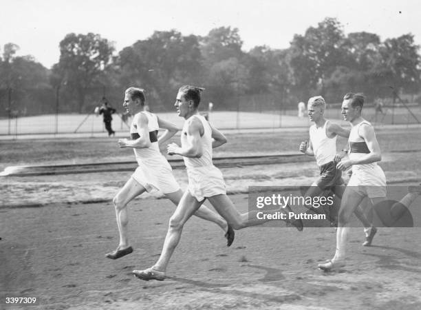 Four members of the German athletic team training in Battersea Park for the International Relay and Test Match against England at Stamford Bridge,...