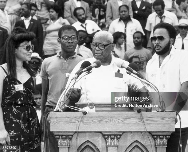 Martin Luther King Sr. Addressing a rally on the steps of the Lincoln Memorial, Washington DC with Martin Luther King III and other members of their...