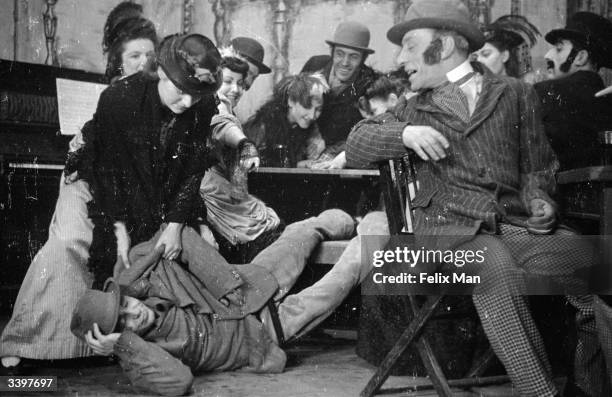 Audrey Hale of The Unity Theatre, based in London, tries to wake her drunken husband in 'Winkles and Champagne', produced by William Rowbotham, based...
