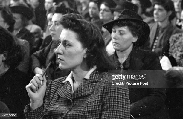 Women war workers listen to an address by Ernest Bevin. Original Publication: Picture Post - 1565 - Bevin Talks To Women Workers - pub. 1943