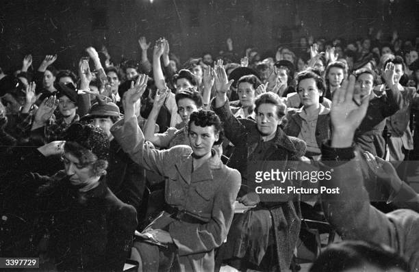 Women workers vote to forge links with the women workers of the Soviet Union, after an address by Ernest Bevin. Original Publication: Picture Post -...