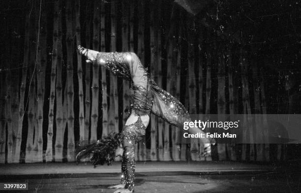 Rubye Colleano, of the half-Irish, half-Spanish circus act the Colleano Family, and wife of actor Bonar, performing a handstand as part of their...