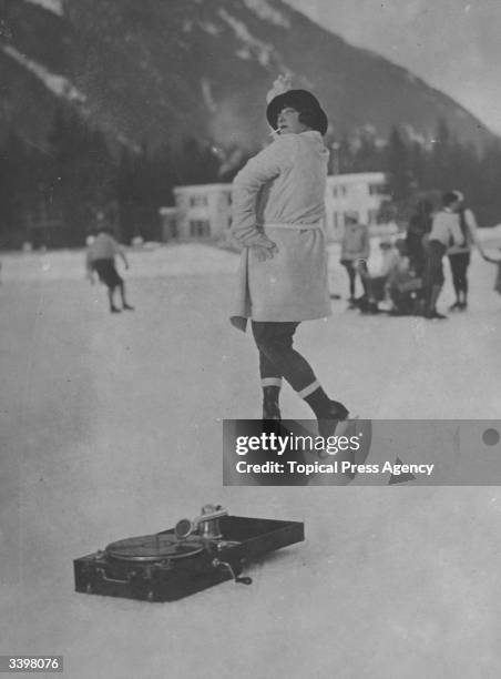 Woman dancing to a gramophone in Chamonix, France.