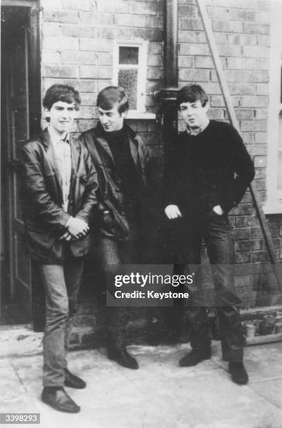 Liverpudlian skiffle beat band The Beatles standing outside Paul's Liverpool home George Harrison , John Lennon , Paul McCartney. Ringo Starr was not...