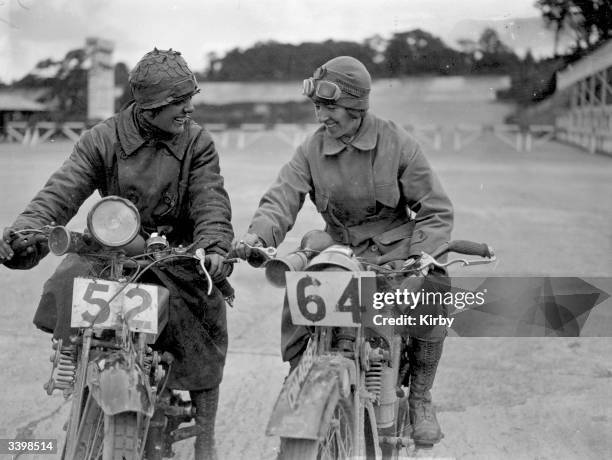 Miss E Foley and Miss L Ball on their motorcycles at the International Six Days Reliability Trials at Brooklands race track.