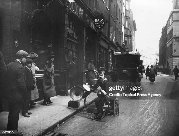 One-man band playing jazz in a street.