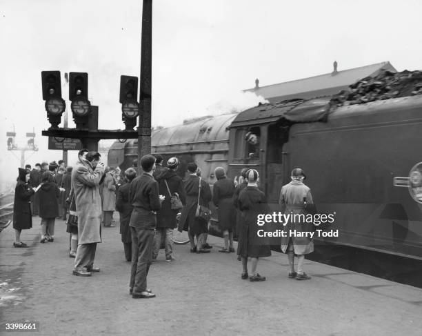 League of trainspotters young and old crowd the number 10 platform at London's King's Cross Station.