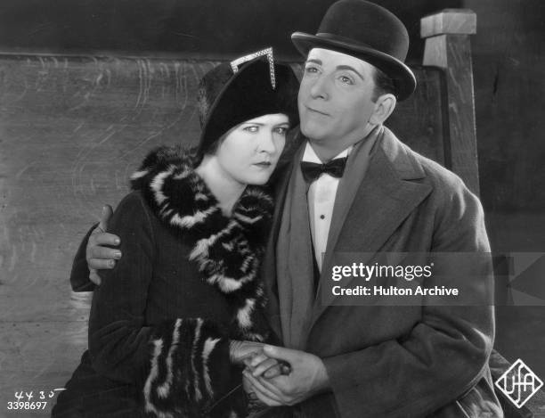 Edward Everett Horton puts a consoling arm round Laura La Plante, a scene from the film, 'Robinson'.