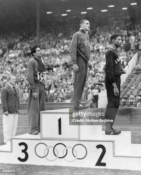 Metre Olympic Gold, Silver and Bronze medal winners on the winners rostrum at the 1948 London Olympics at Wembley Stadium. Left to right Marcel...