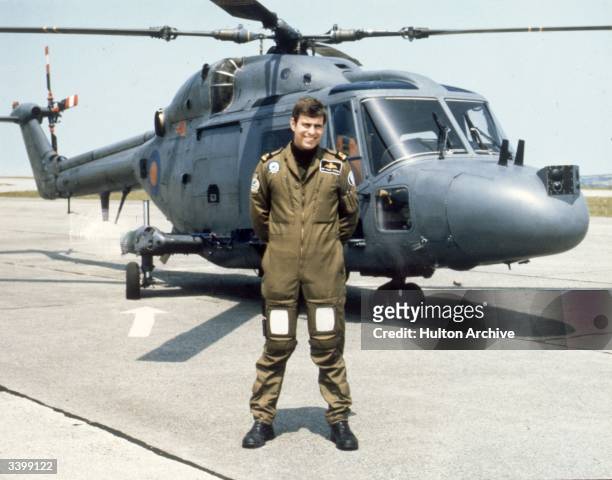 Prince Andrew, the Duke of York, at Naval Air Station Portsmouth, in front of a Westland Navy Lynx helicopter.