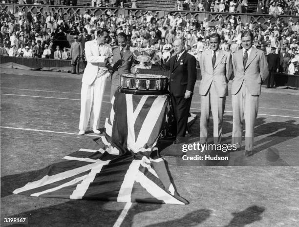 The presentation of the Davis Cup to the winning British team at Wimbledon. Left to right: Fred Perry, Bunny Austin, Henry Roper Barrett, Pat Hughes...