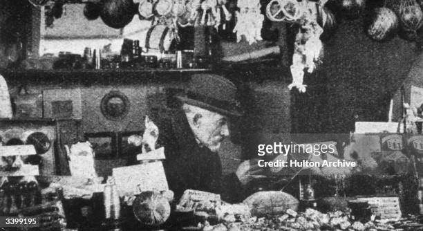 French magician, actor, film maker, designer and theatre manager Georges Melies selling toys.
