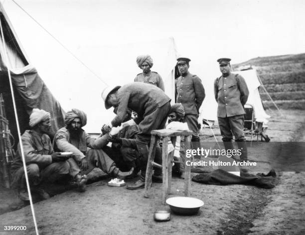 Medical orderly treating the sick and wounded during the siege of Tsingtao in the First World War.