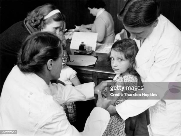 Child is injected with a vaccine against paralytic poliomyelitis, the first stage of the biggest vaccination programme ever undertaken in Britain....