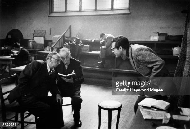 American actor and producer Sam Wanamaker directs actors Miles Malleson , left, and Harry Hutchinson in a rehearsal of Sean O'Casey's play 'Purple...