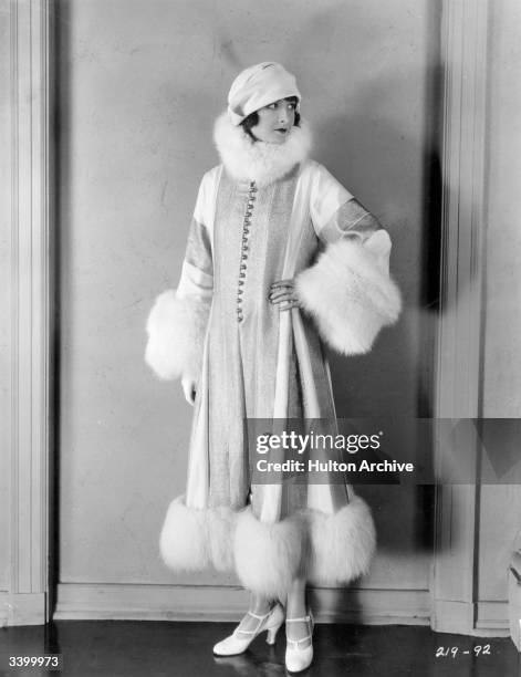 American actress Eleanor Boardman , wife of director King Vidor wearing a fur-trimmed outfit for her role in the silent film 'Proud Flesh', directed...