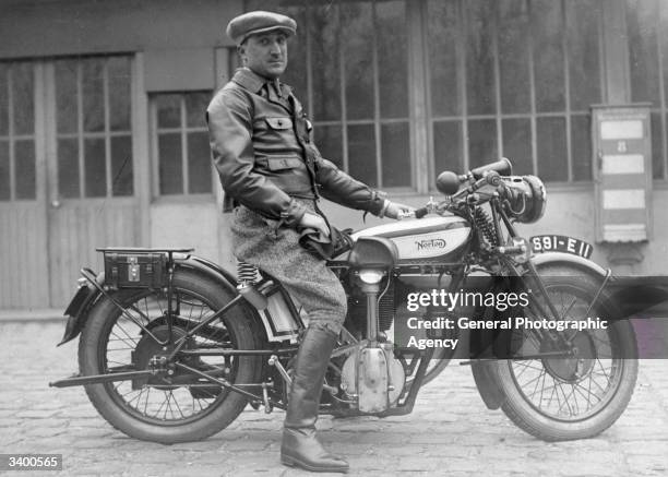 Man on a Norton motorcycle.